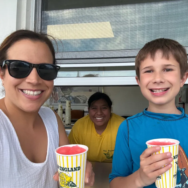 Suzy and a young volunteer enjoying slushies together